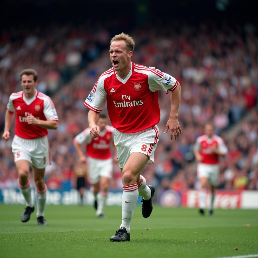 Dennis Bergkamp ăn mừng bàn thắng trong màu áo Arsenal